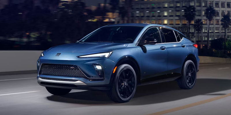 Blue Buick Envista driving at night