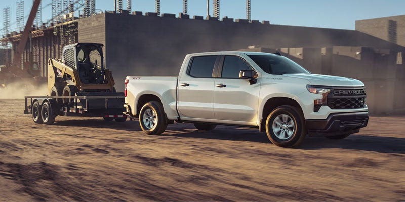 2026 Chevrolet Silverado 1500 with Heavy Duty Equipment on Trailer